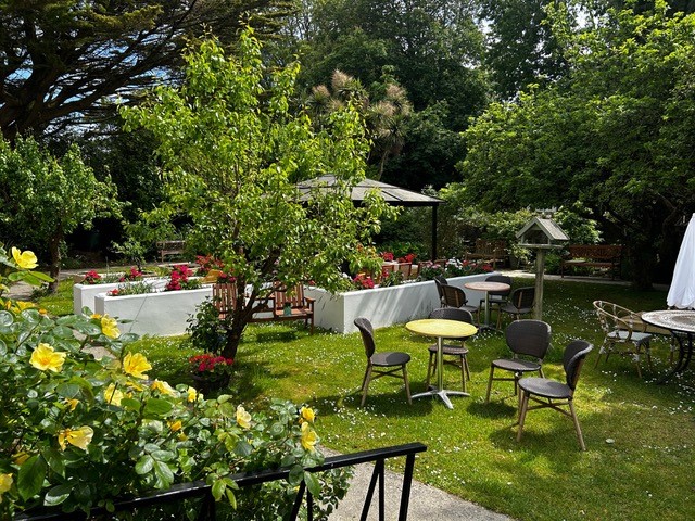 The sunny landscaped garden at Hadleigh Court